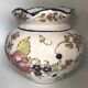 Round earthenware vase with polychrome floral motifs, signed