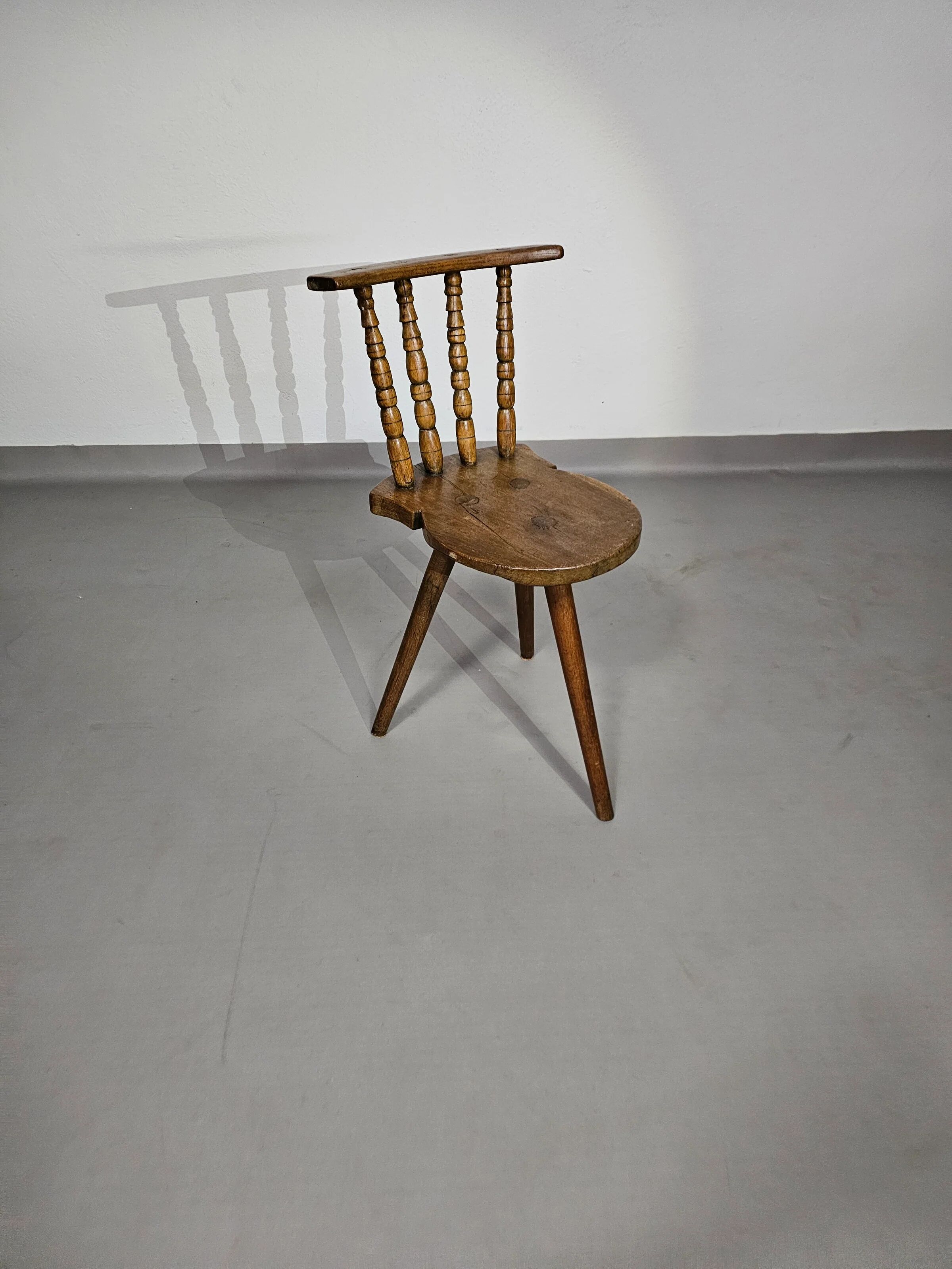 Old farmers tripod chair for decorative use