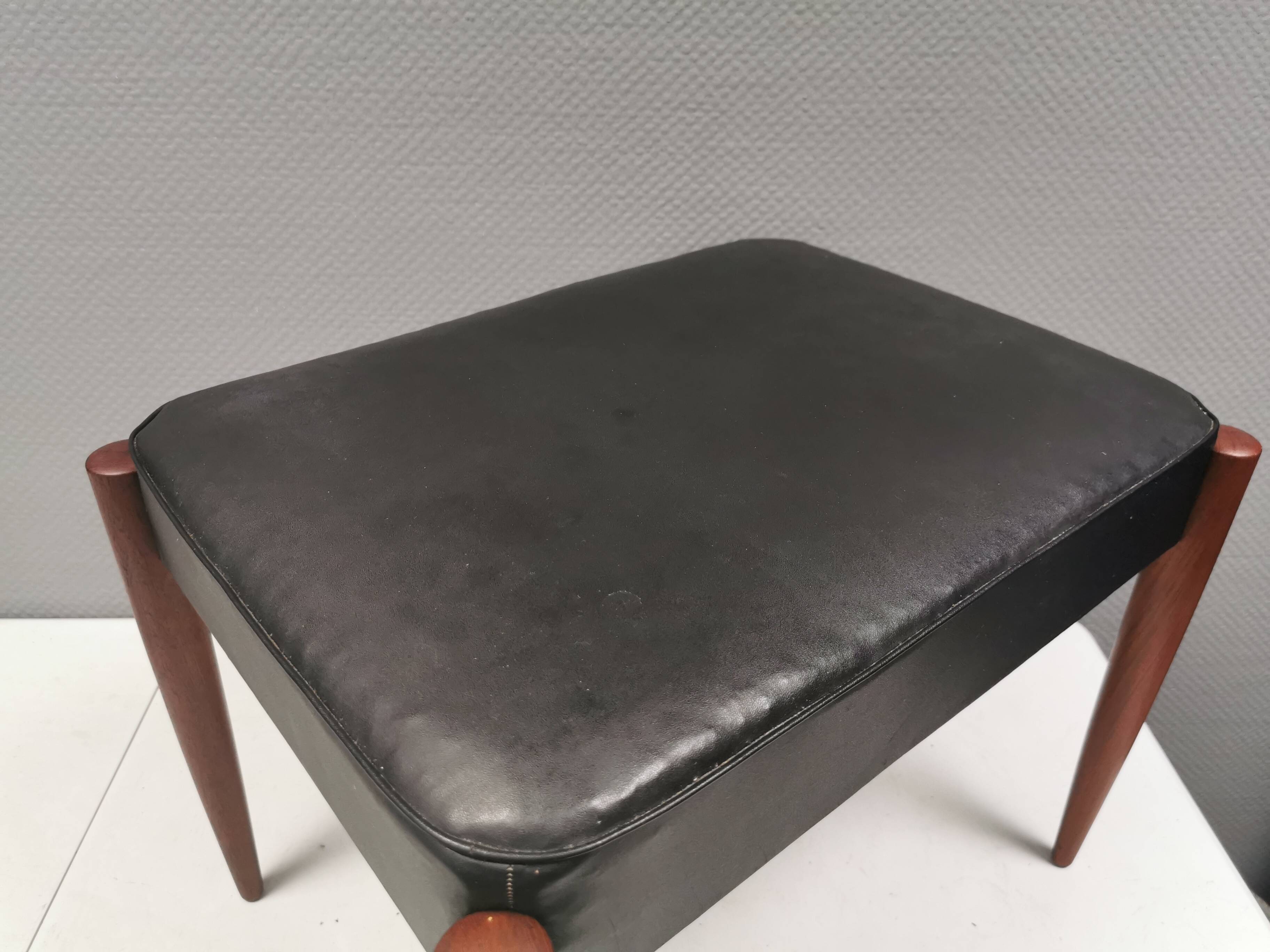 Footstool with teak wood legs and black skai (imitation leather) 1970s