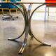 Table ovale en verre fumé et inox