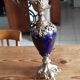 Pair of golden regulated ewers and blue glass