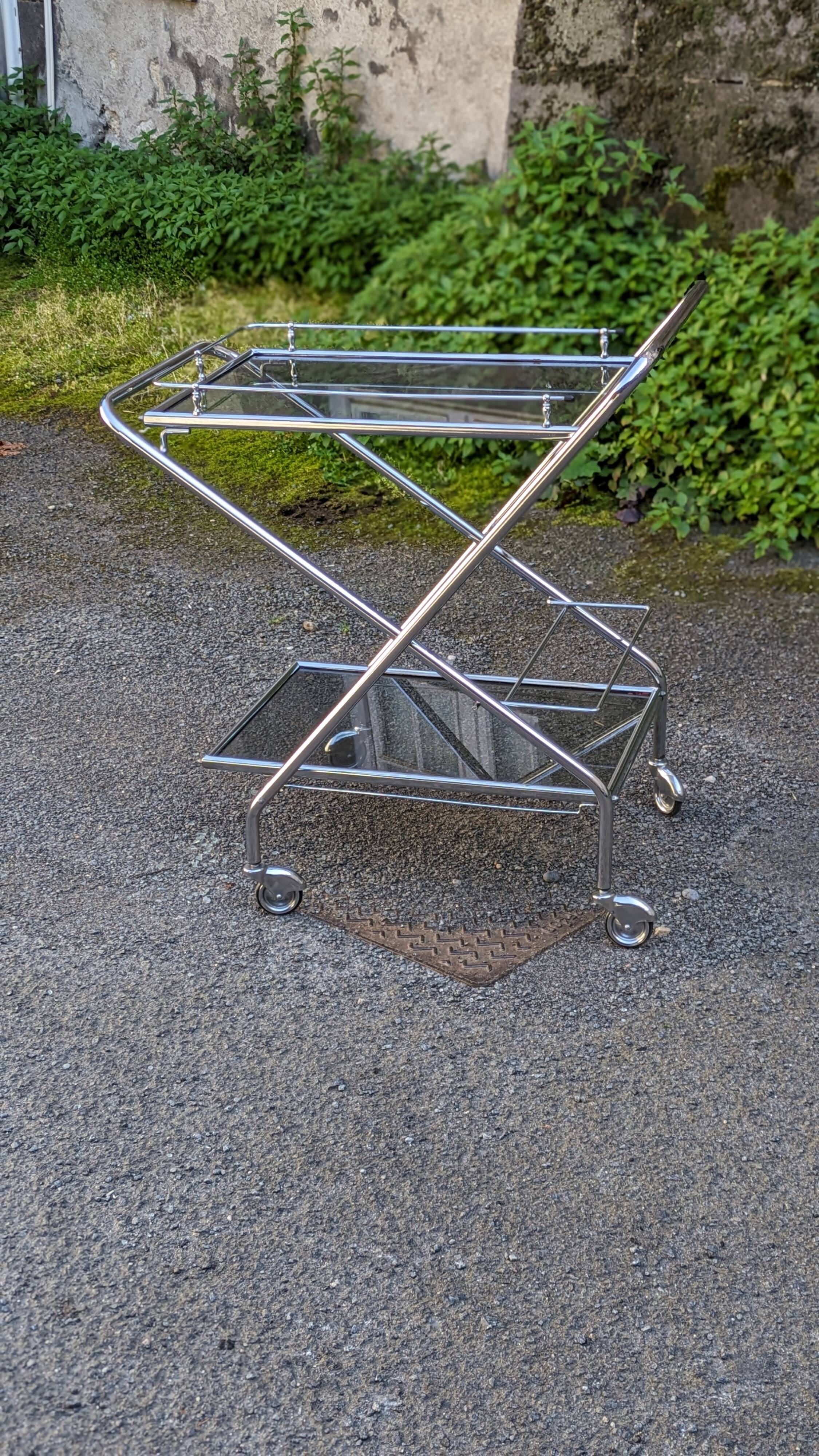 Foldable stainless steel serving trolley with smoked glass tops