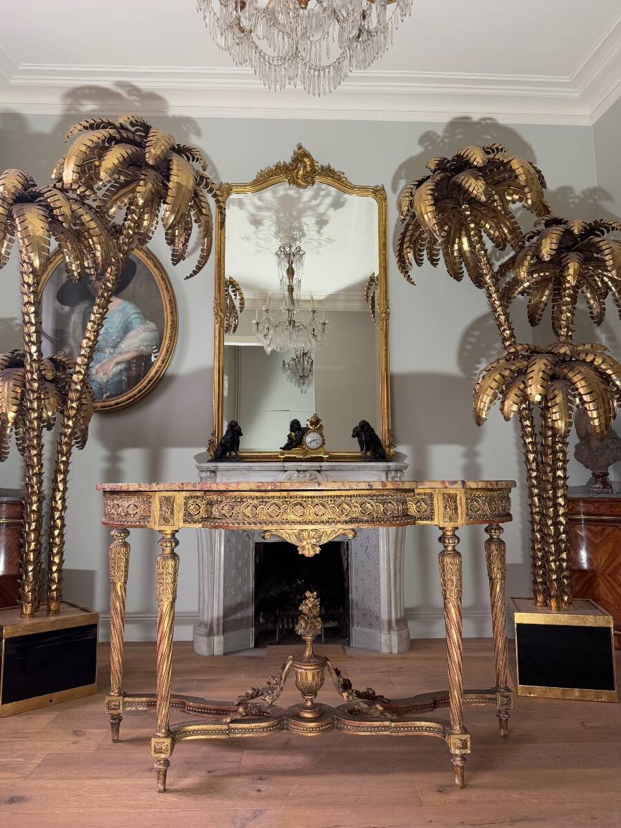 Console with 4 legs from the end of the 19th century in gilded wood in the Louis XVI style.