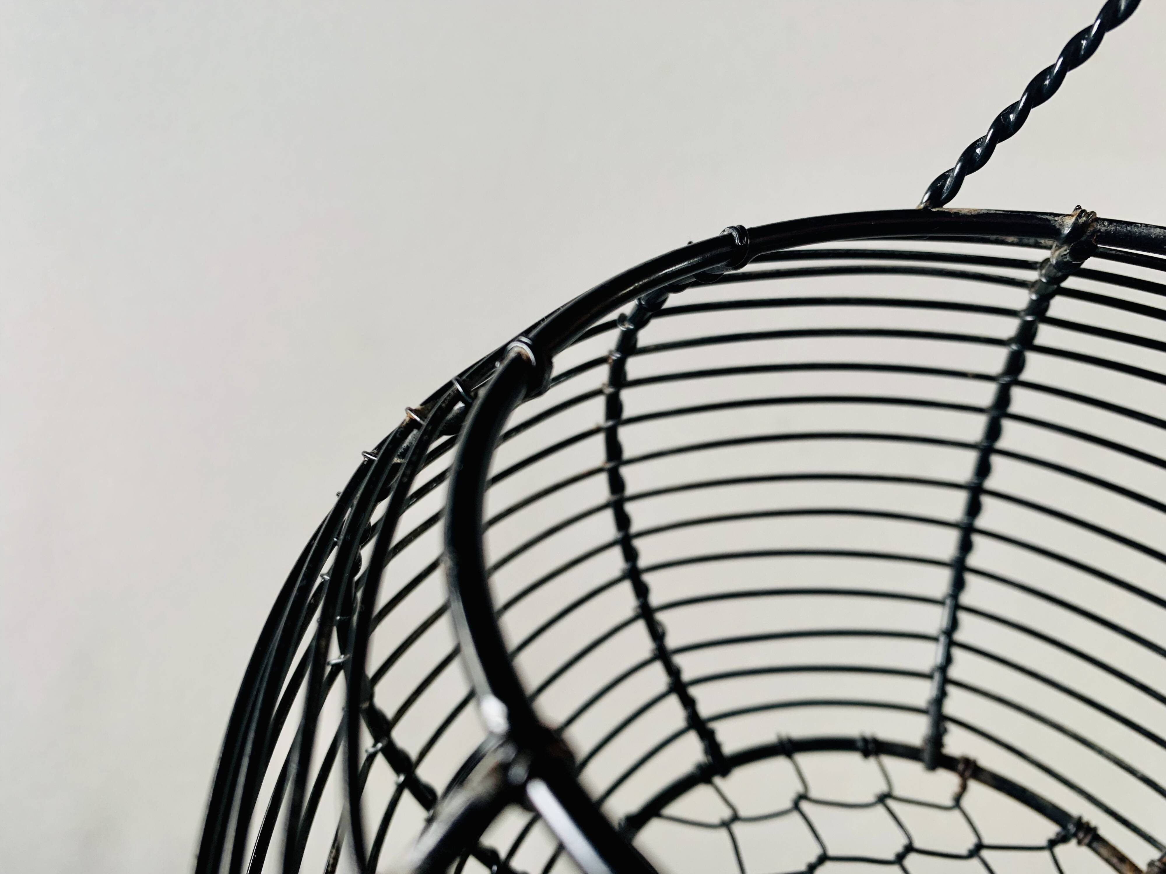 Vintage black metal egg basket