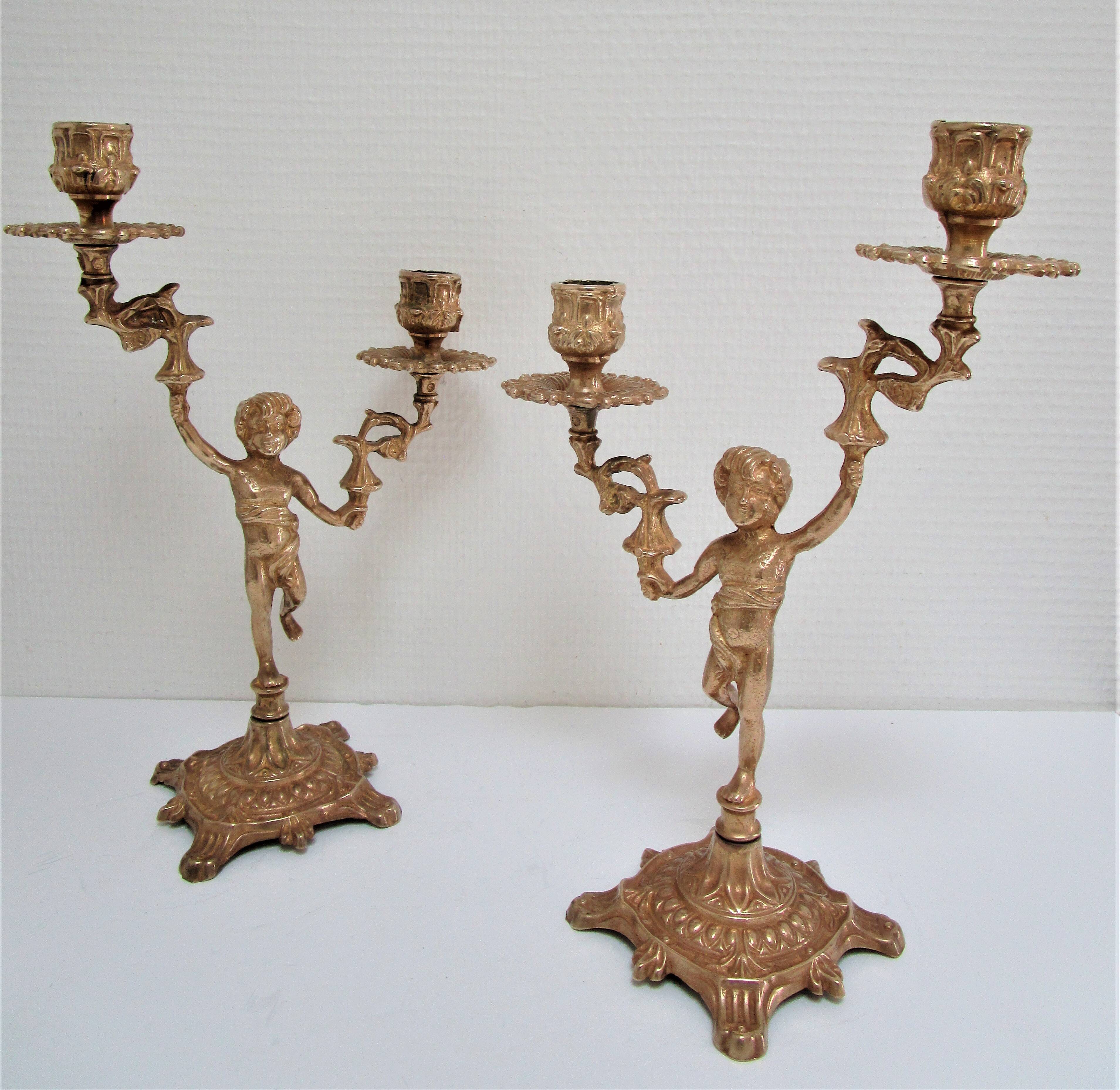 Pair of vintage golden brass cherub candlesticks