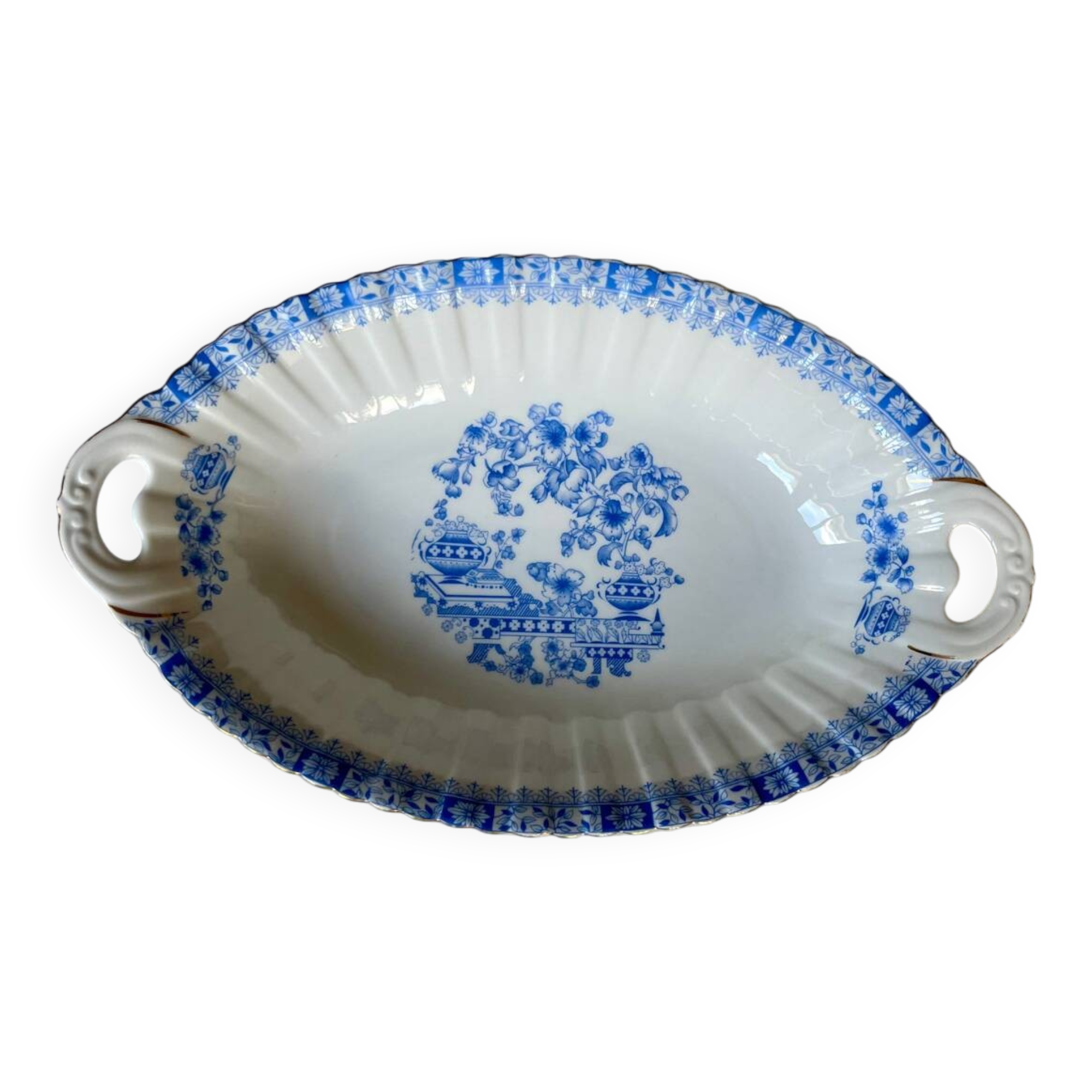 Antique oval dish with handles in earthenware