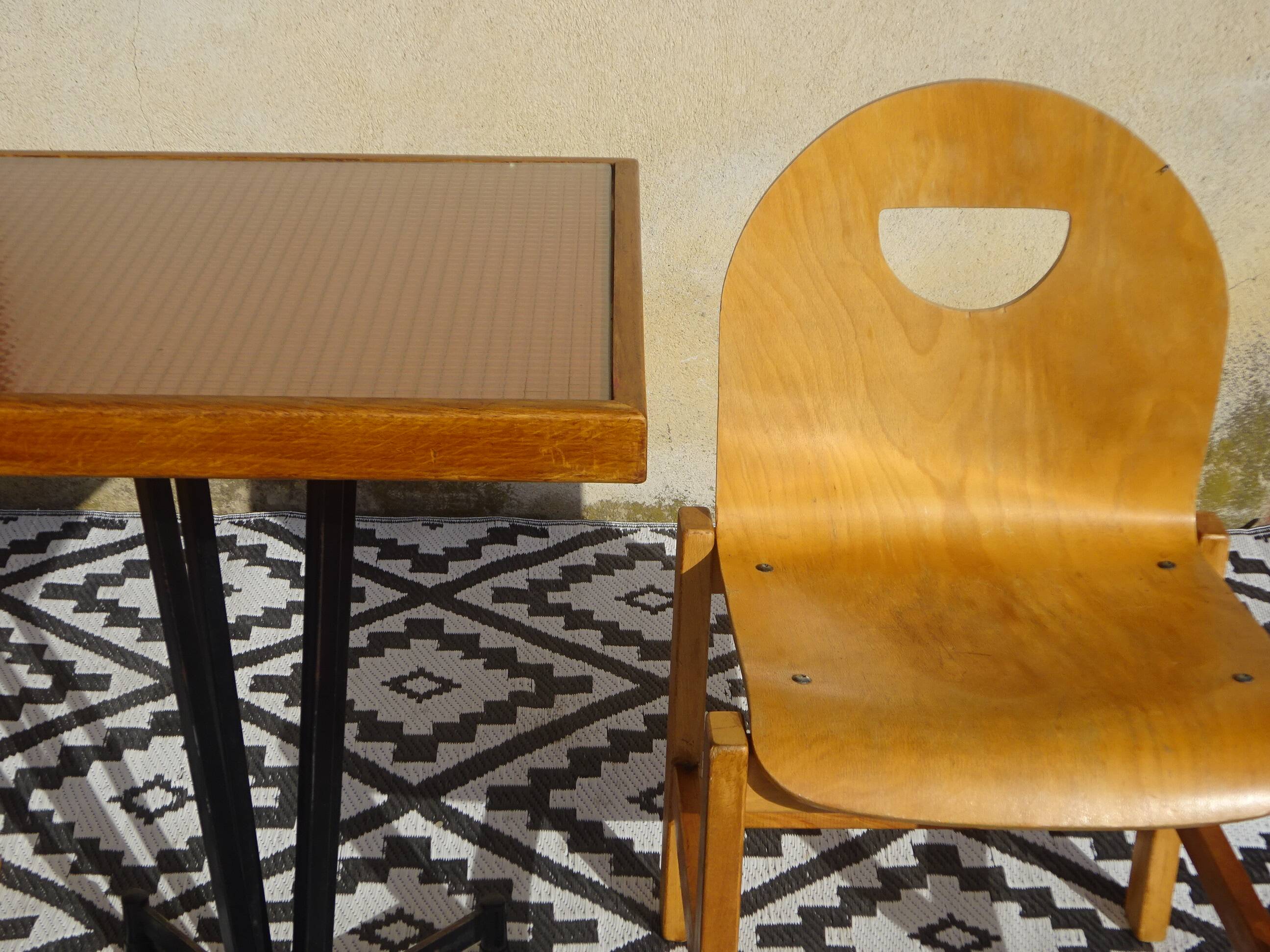 Pair of light wood chairs with post-formed seat and backrest.