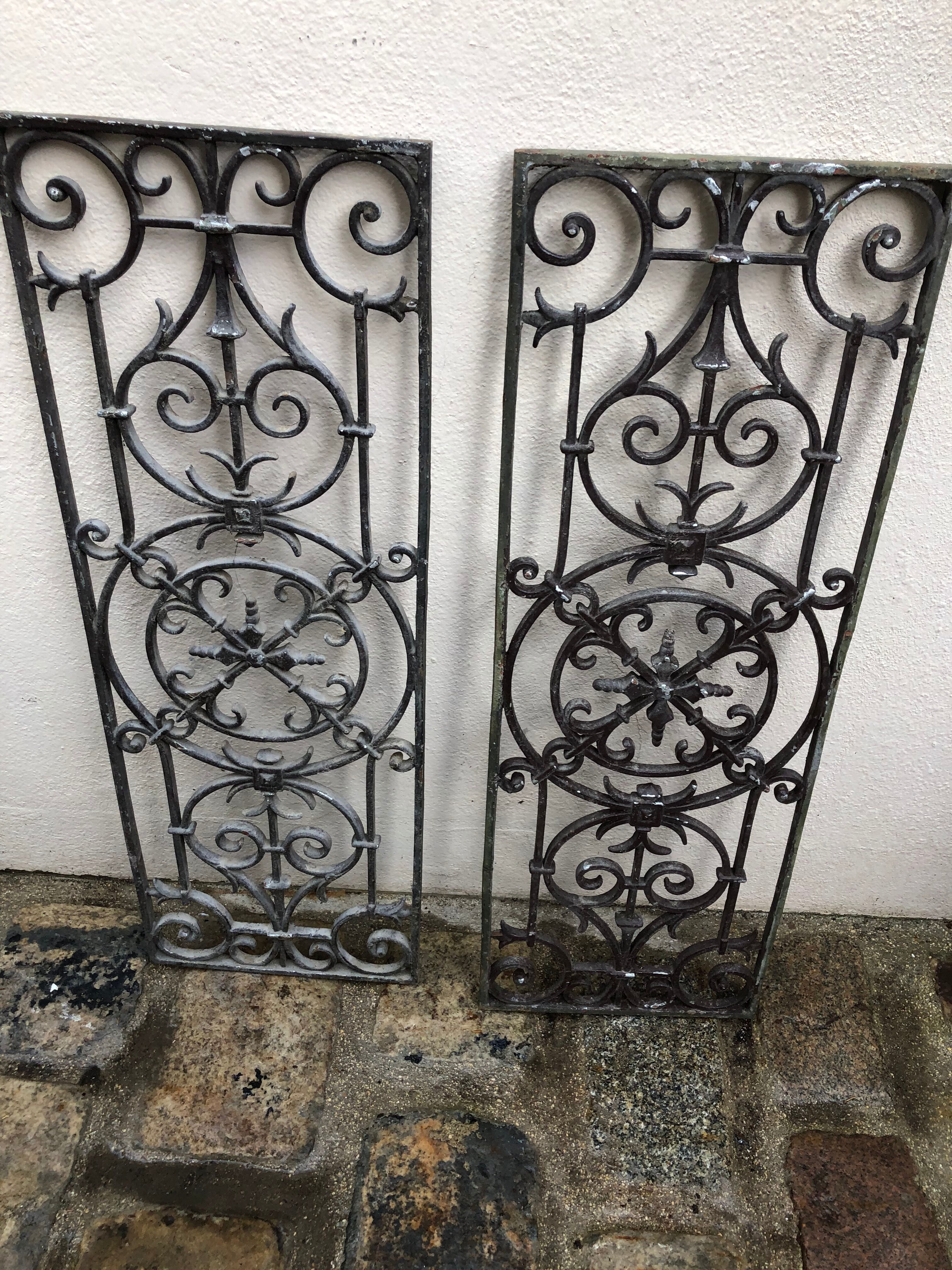 Pair of old cast iron door grilles