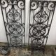 Pair of old cast iron door grilles
