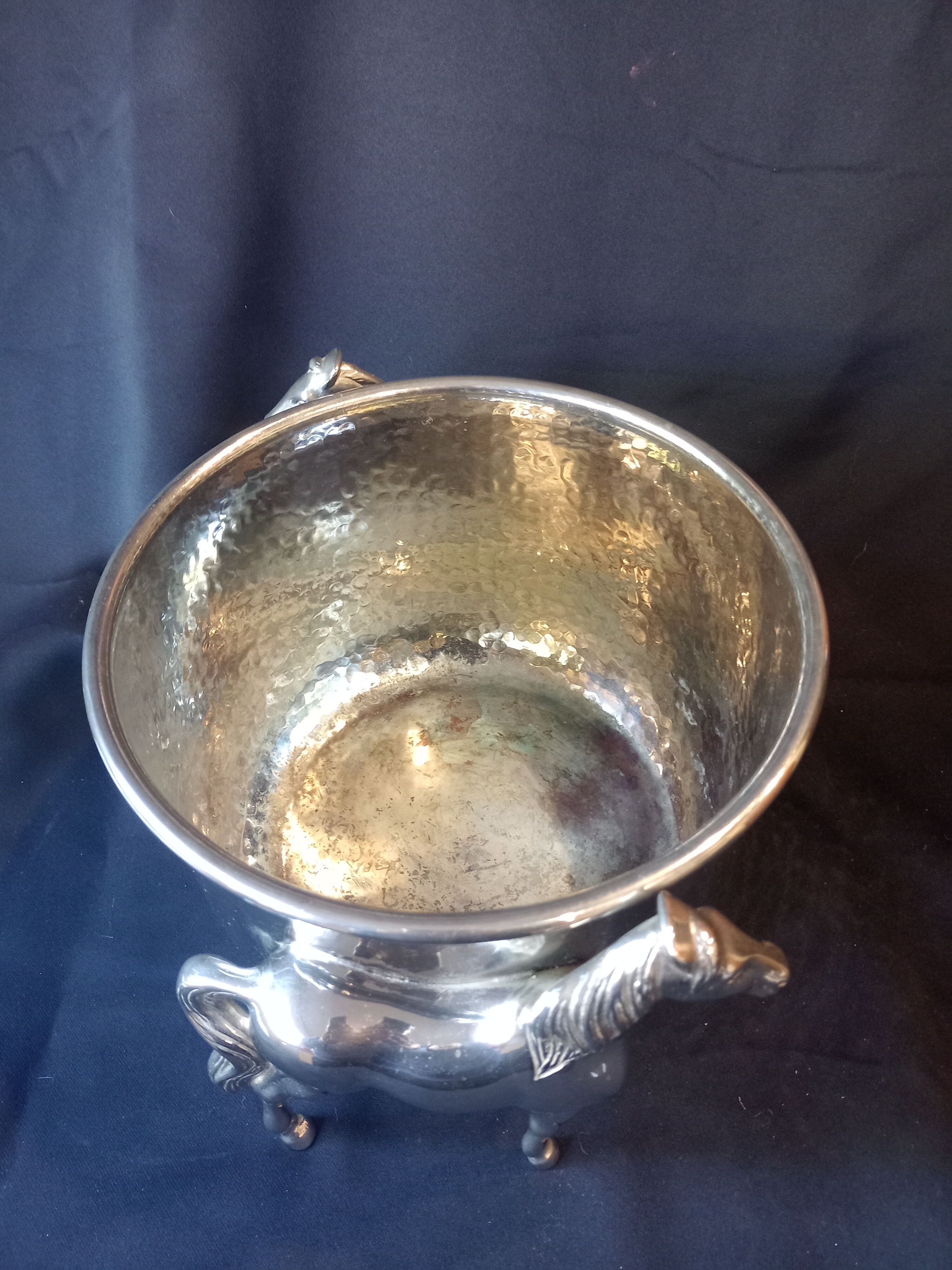 Bucket with decoration of horses