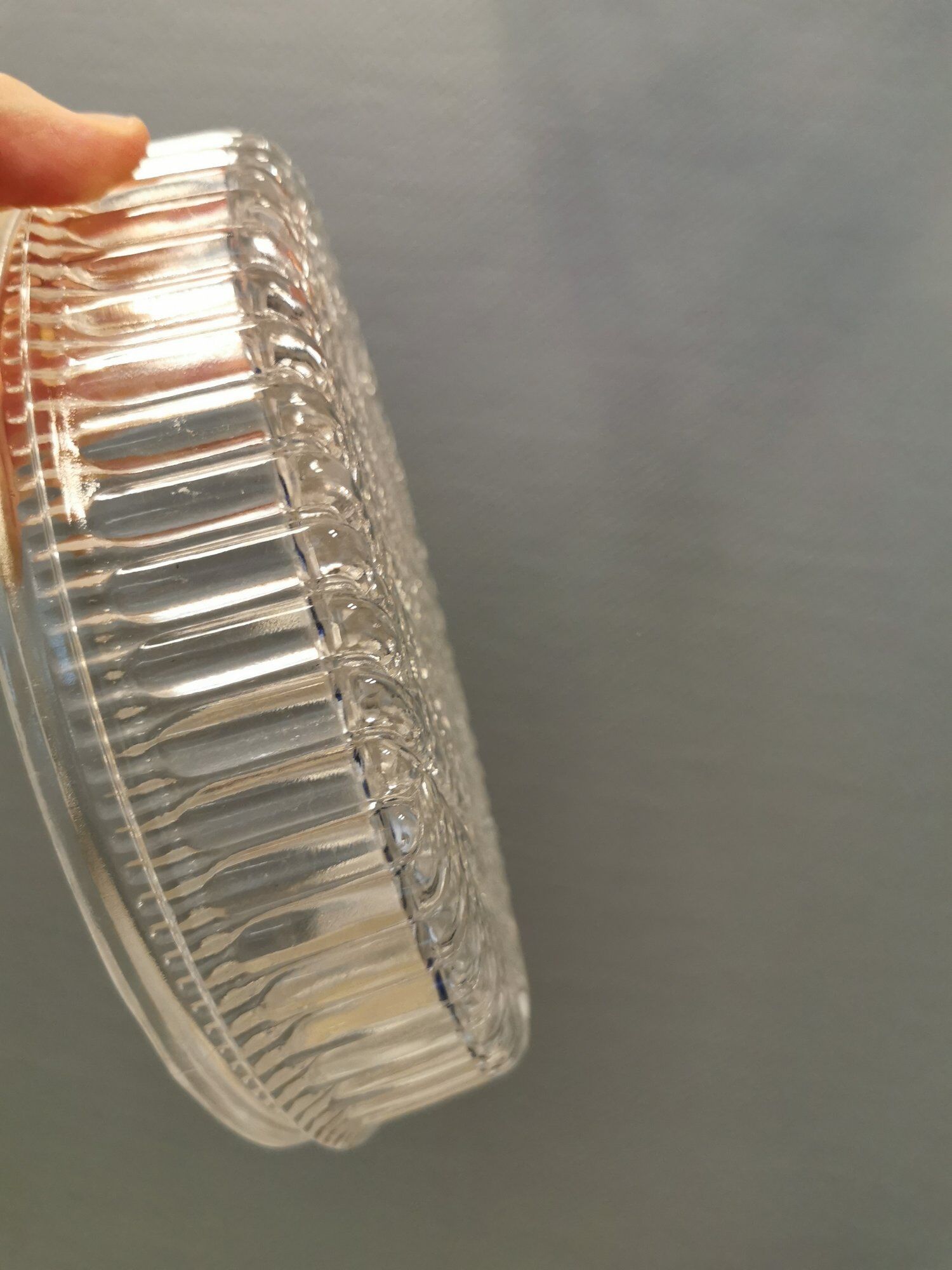 Ceiling light, in dark metallic paint with thick glass shade with beautiful details in the glass.