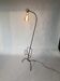 Magazine floor lamp in wrought iron and brass, exposed bulb 1960