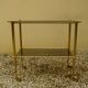 Antique brass serving trolley with smoked glass top, Louis XVI style.