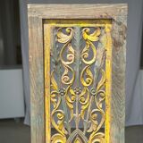 Rectangular Indonesian construction element with blue and yellow plant in carved wood