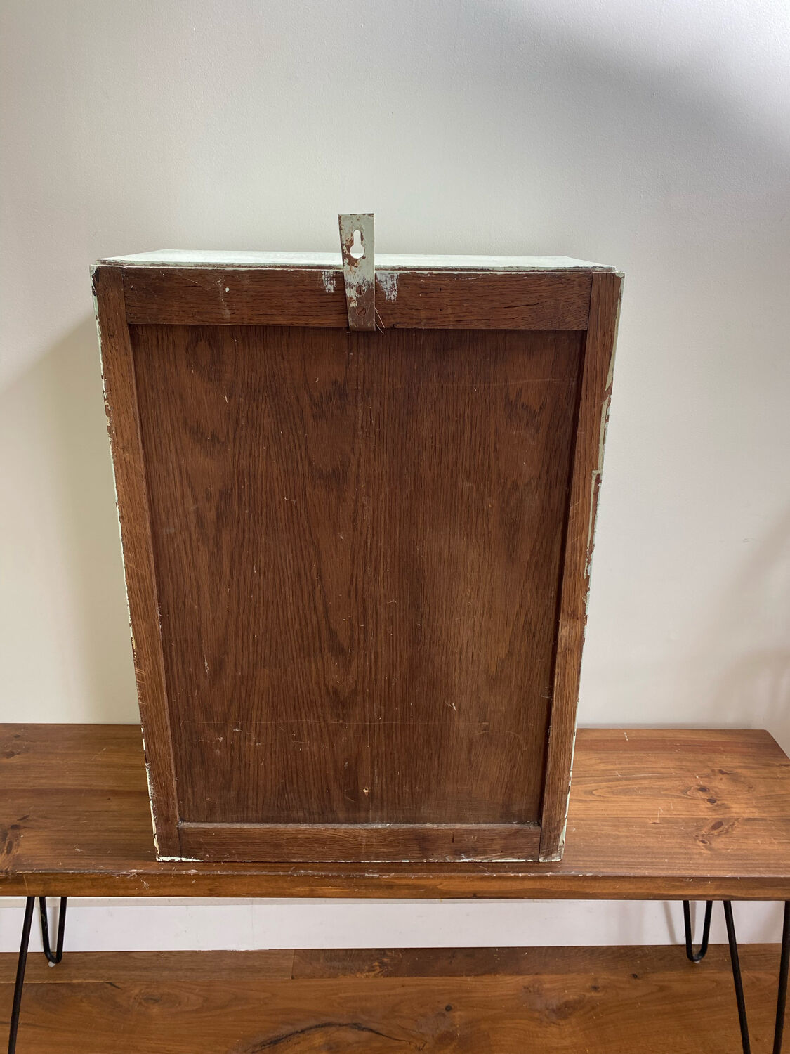 Old medicine cabinet in mint green patinated wood