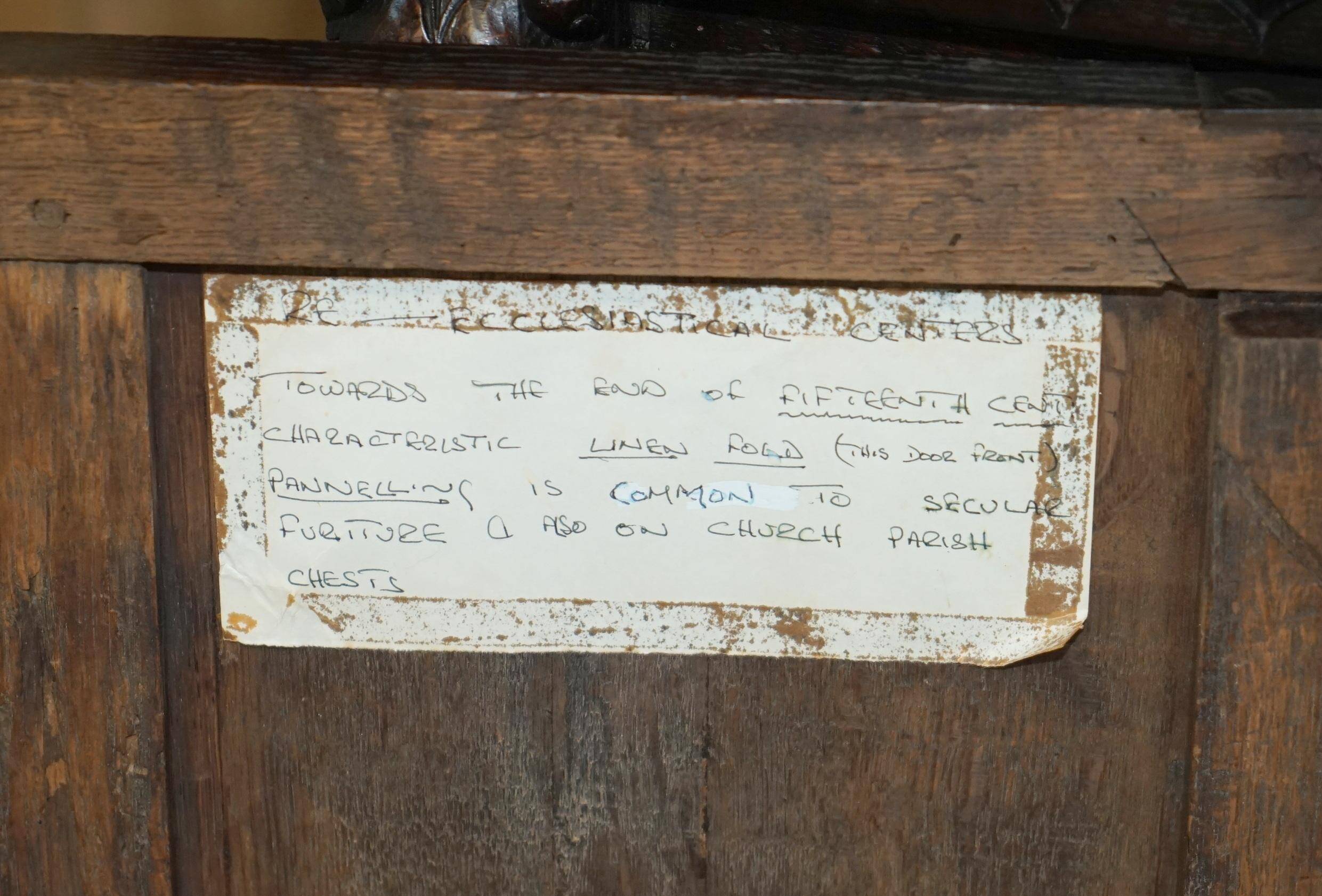 Jacobean hardwood library with carved panels and glass doors.