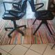 Two black leather armchairs