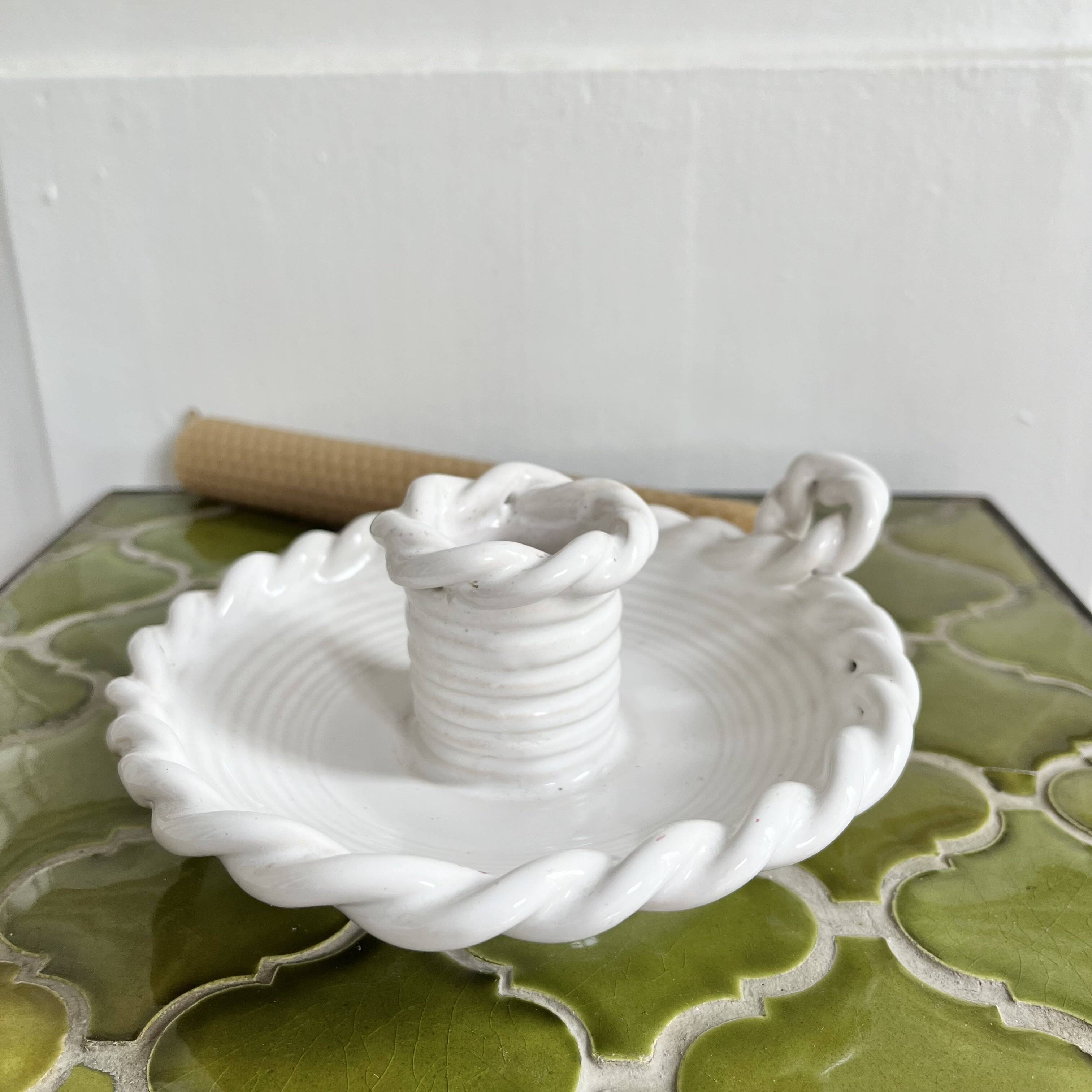Hand-held candle holder with braided ceramic bowl