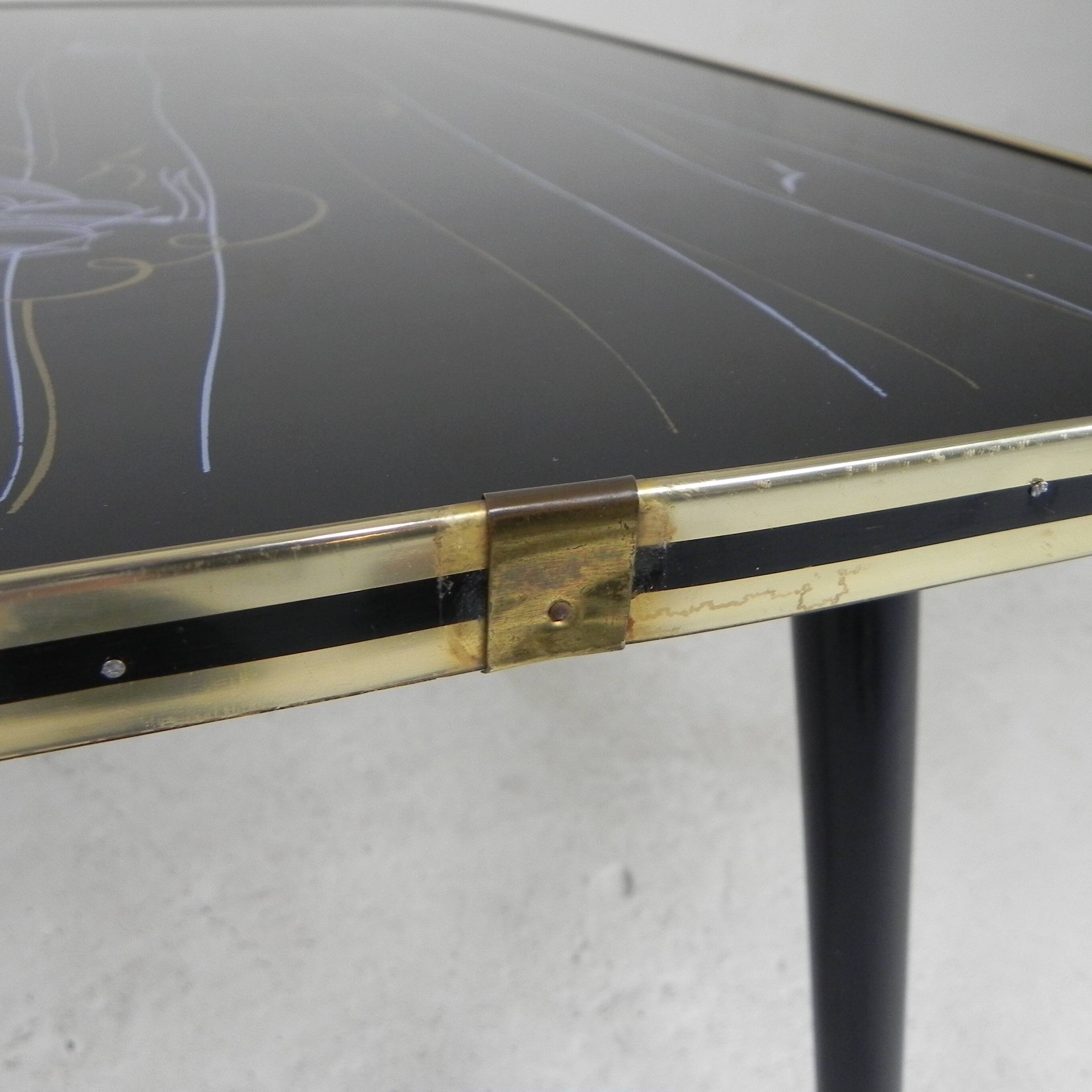 Vintage coffee table with glass top and angled legs