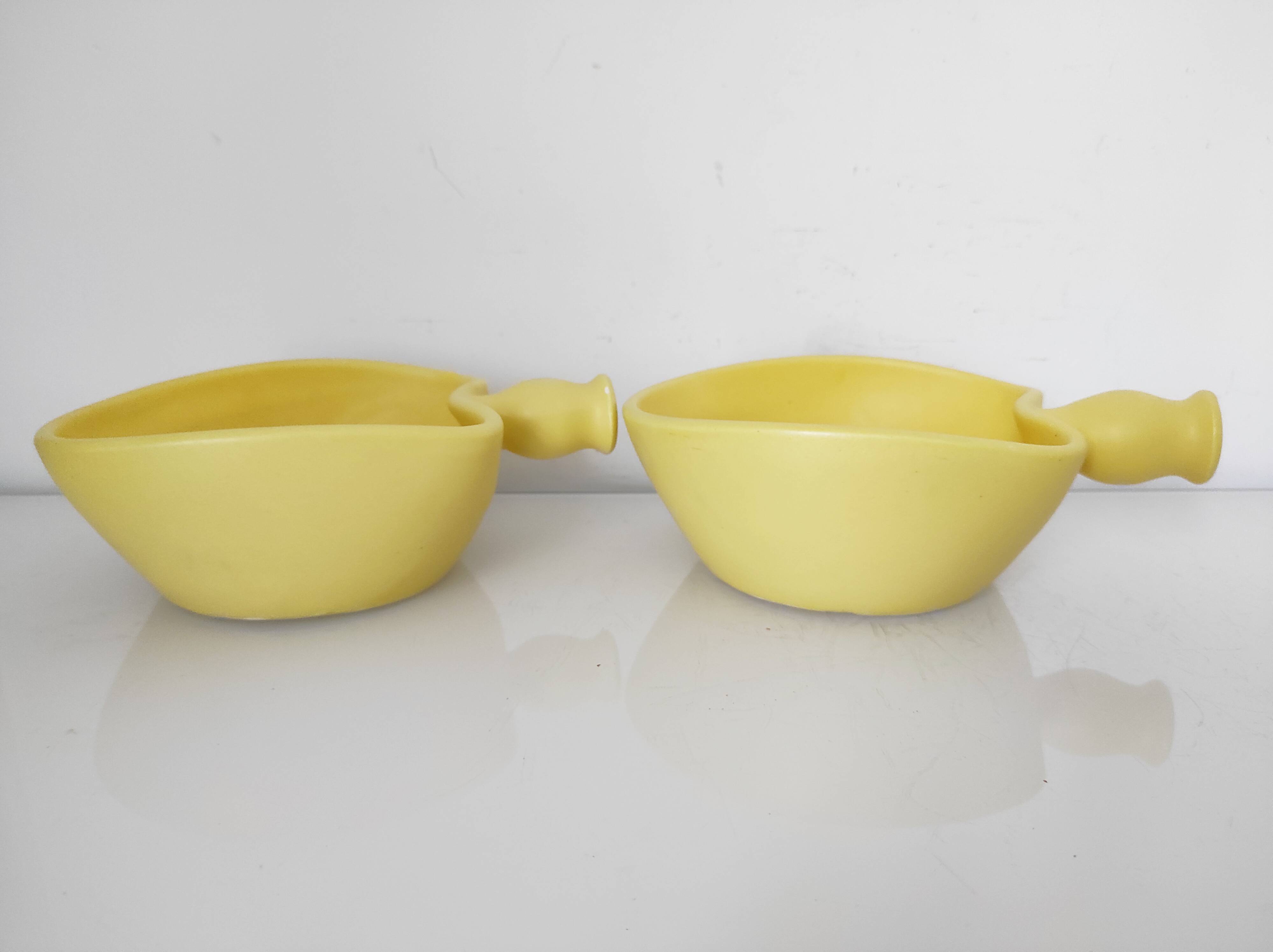 Two yellow ceramic dishes