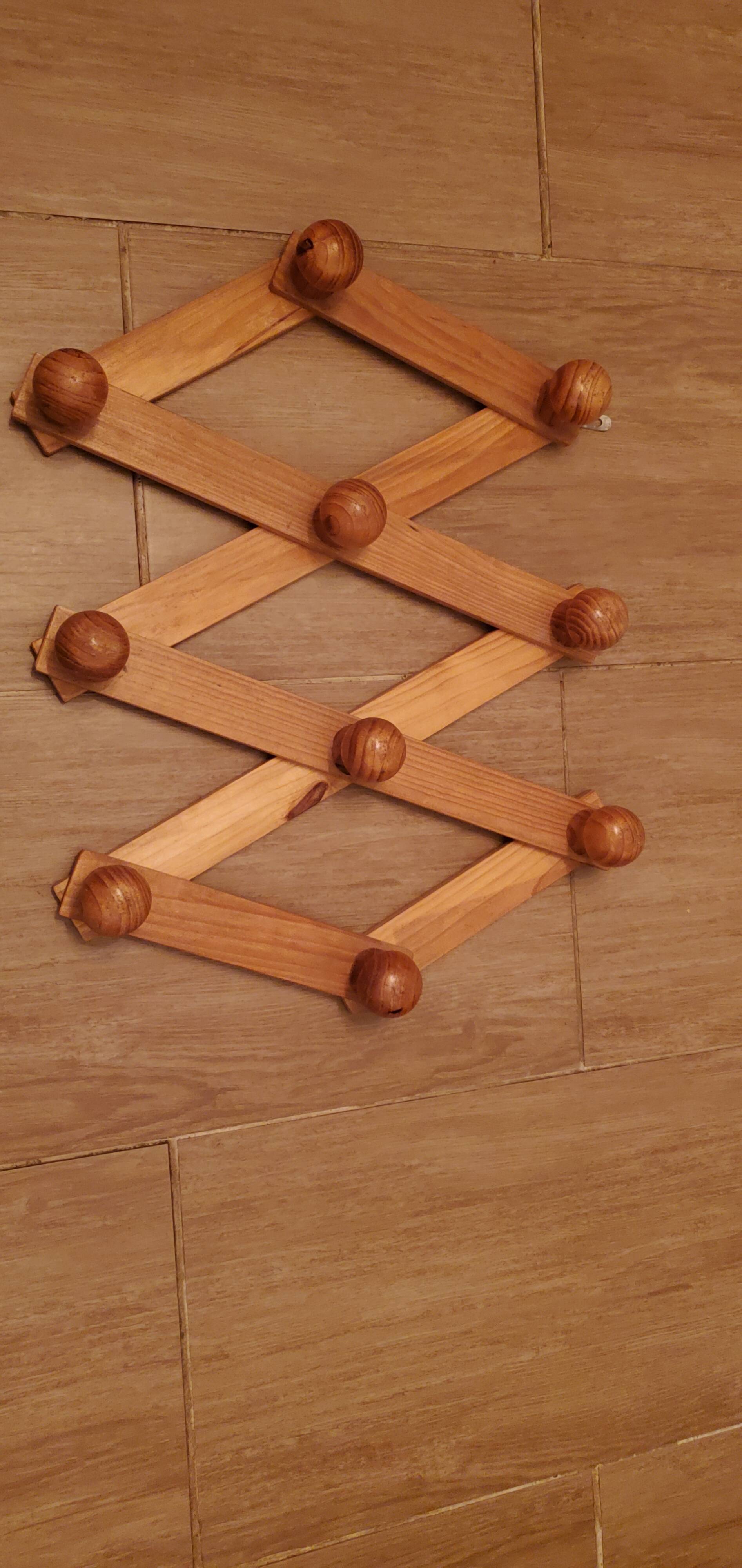 Accordion wall coat rack