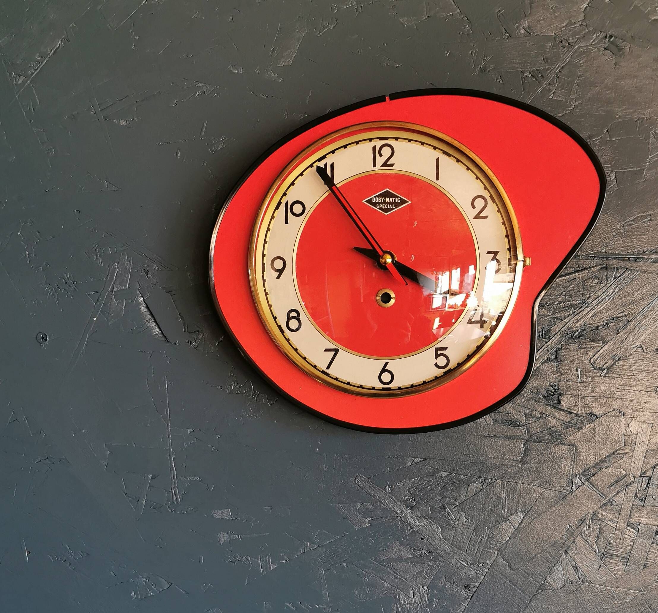 Vintage formica clock silent asymmetrical wall pendulum "Doby Matic red"