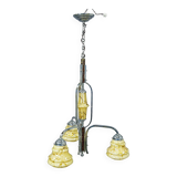 Antique Art Deco chandelier with three glass lampshades.