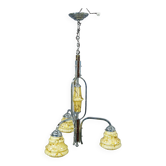 Antique Art Deco chandelier with three glass lampshades.