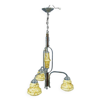 Antique Art Deco chandelier with three glass lampshades.