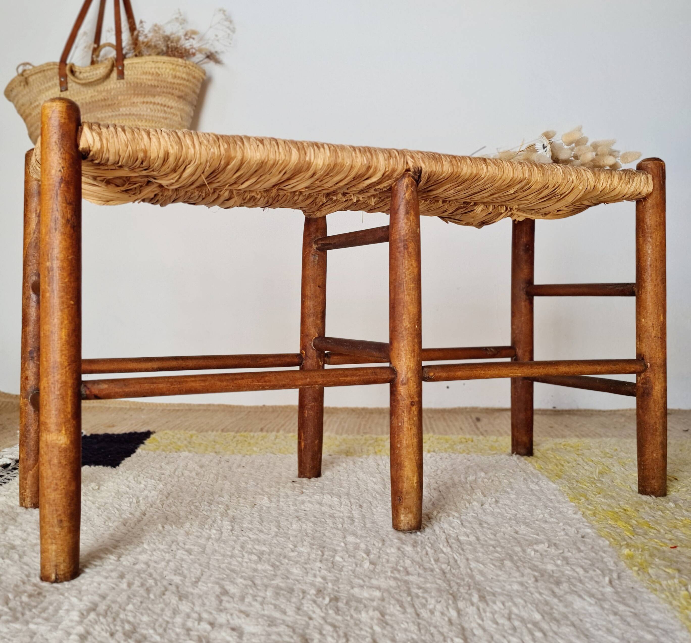Old wooden and straw bench