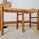 Old wooden and straw bench