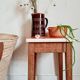 Wooden wax stool and orange formica