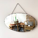 Oval beveled mirror with its chain