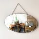 Oval beveled mirror with its chain