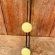Vintage yellow metal wall coat rack
