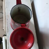 Red enamelled coffee maker with white polka dots