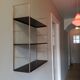 Golden and brown stringed shelf in metal