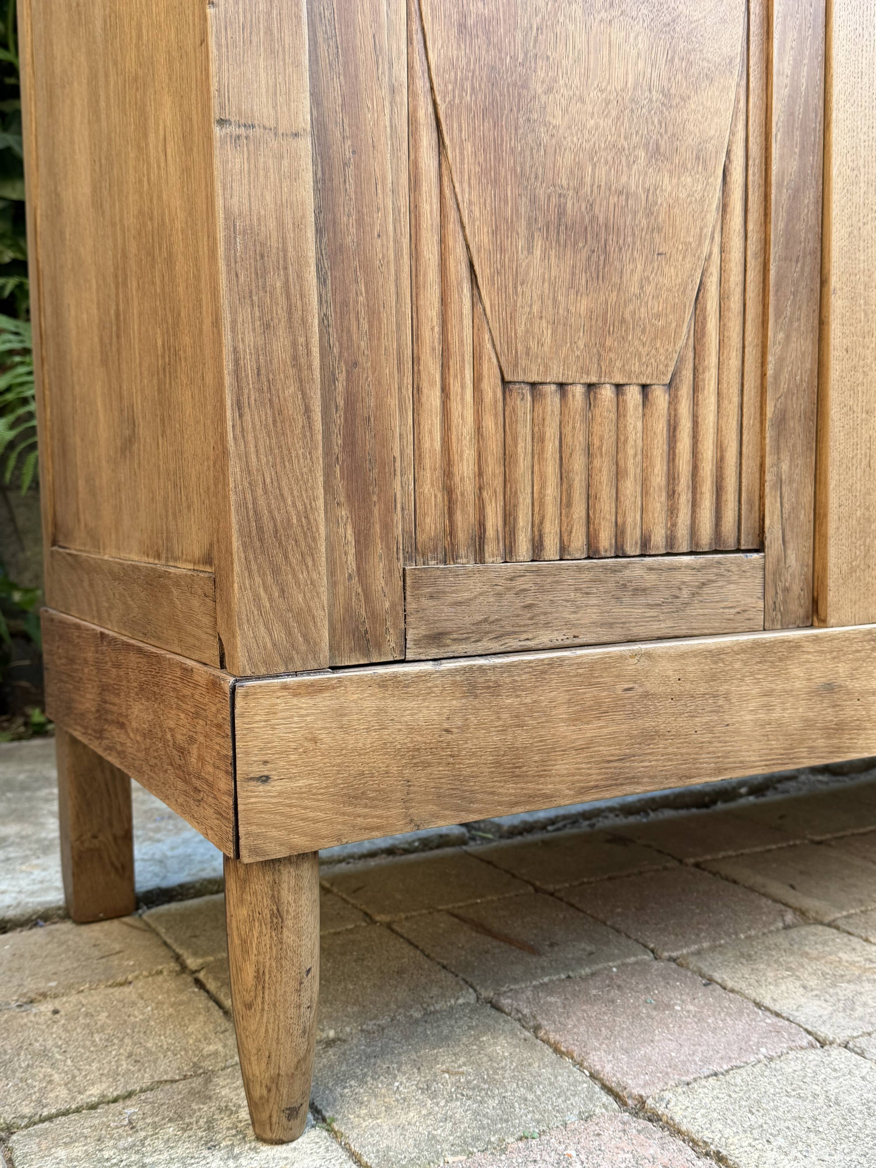 Art deco wardrobe in raw oak with bevelled mirror.