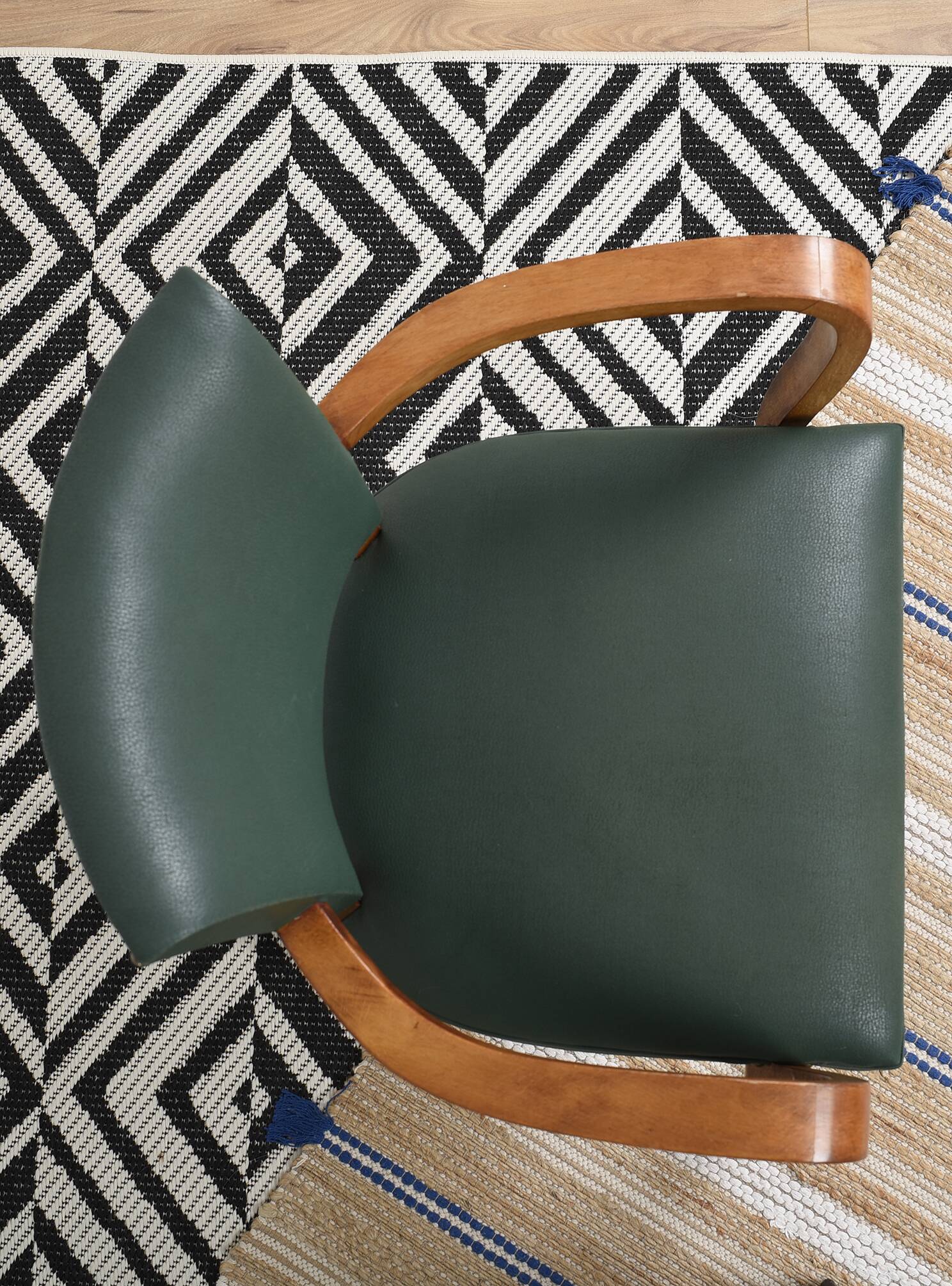 Bridge armchair in green moleskin