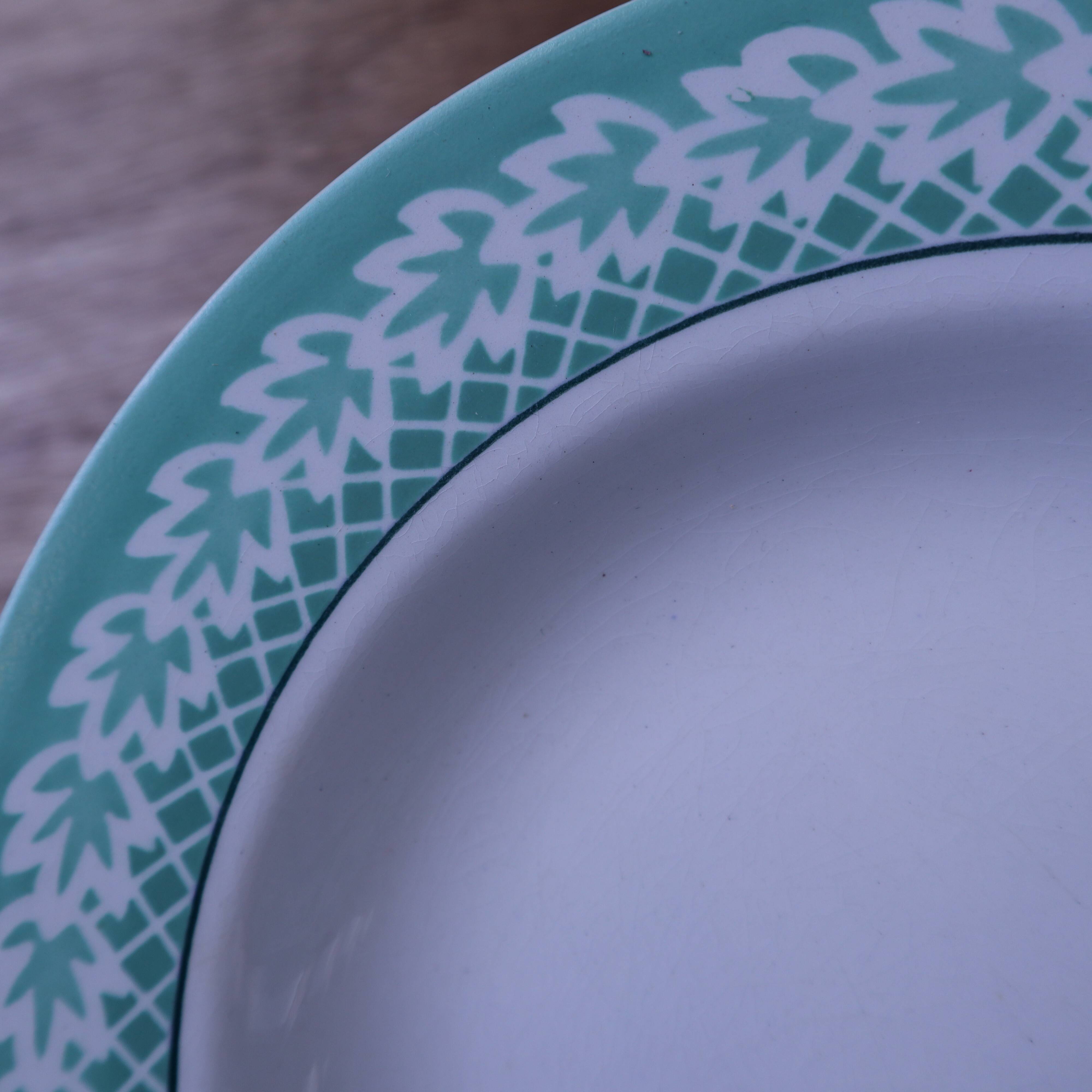 Set of 6 KIFO L'Amandinoise deep plates with green leaf design.