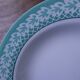 Set of 6 KIFO L'Amandinoise deep plates with green leaf design.