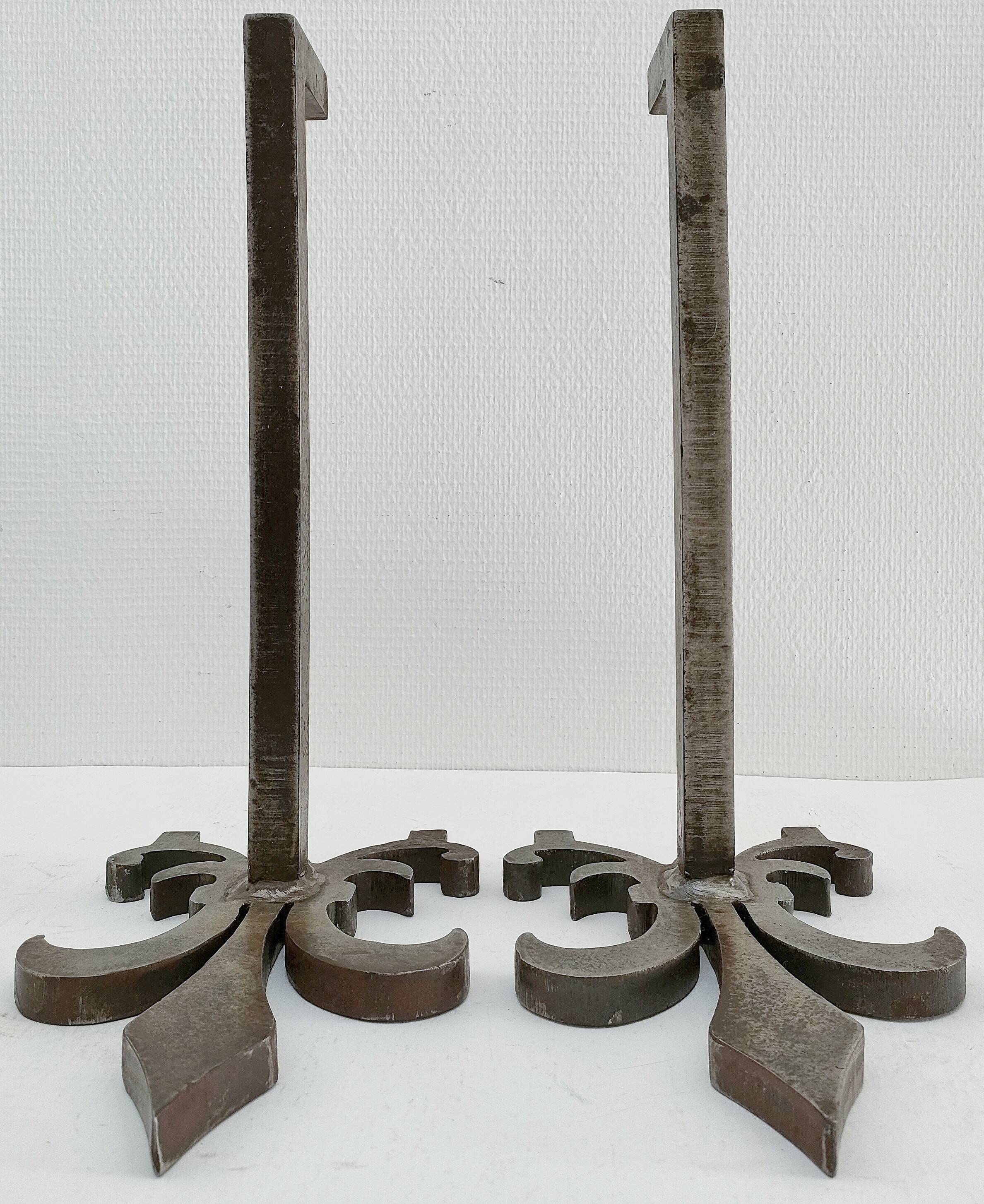Pair of vintage steel fleur-de-lys andirons