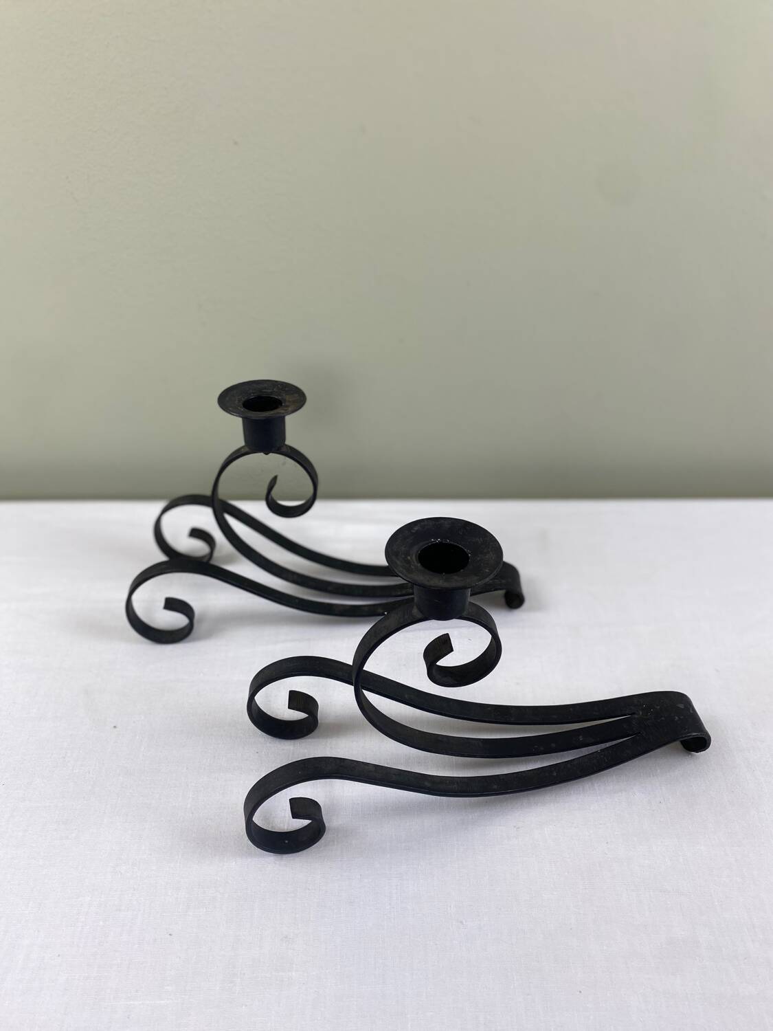 Pair of wrought iron candlesticks