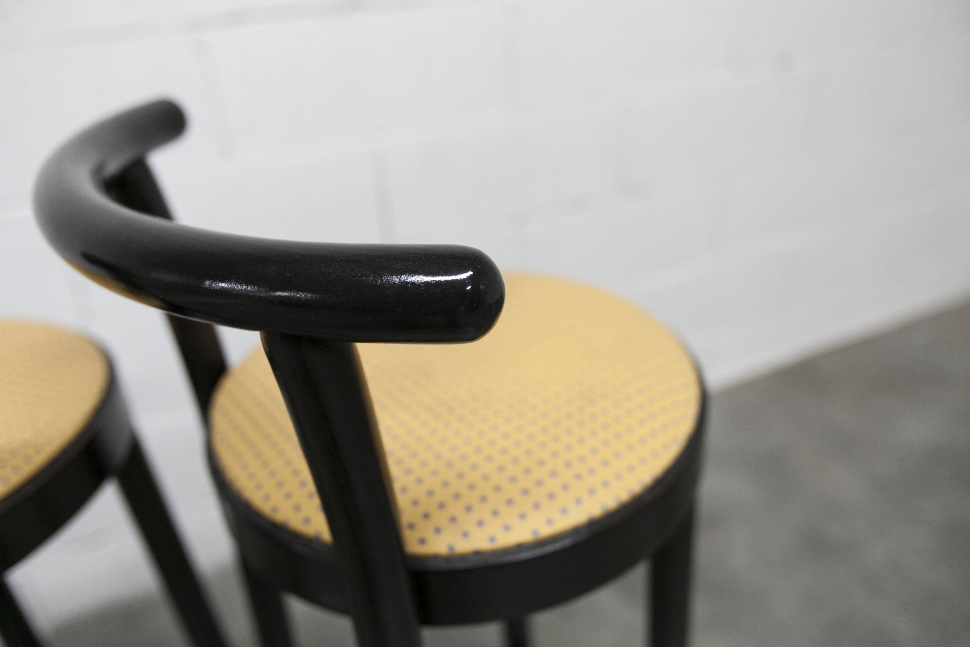 Pair of Baumann stools model Dialog in black and yellow and blue faux leather 1990