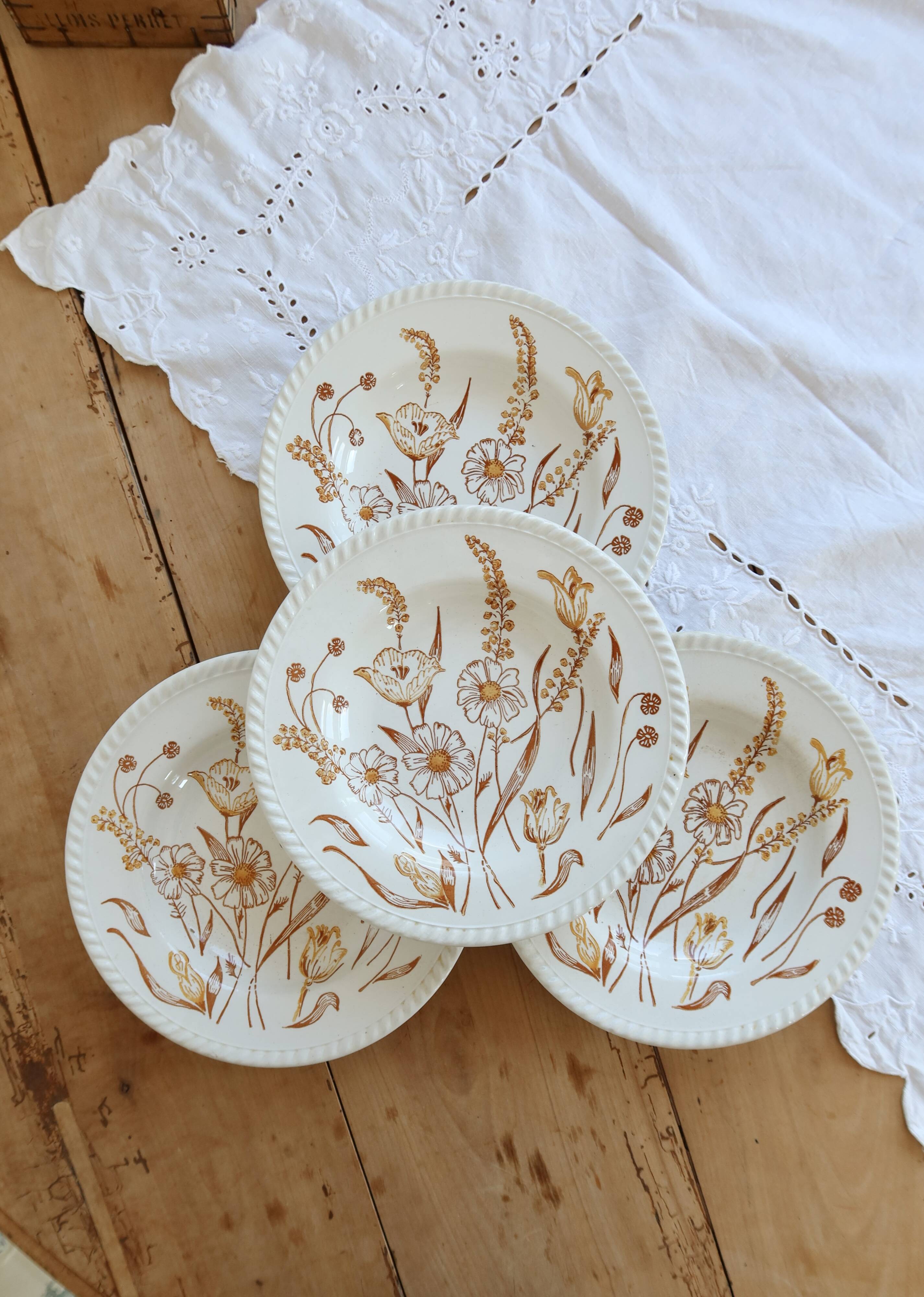4 vintage deep plates with a brown floral design