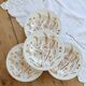 4 vintage deep plates with a brown floral design