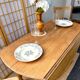 Round oak table with a drop leaf.