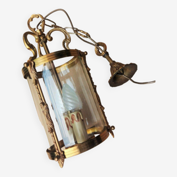 Old cylindrical bronze lantern in Louis XVI style in working order