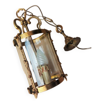 Old cylindrical bronze lantern in Louis XVI style in working order