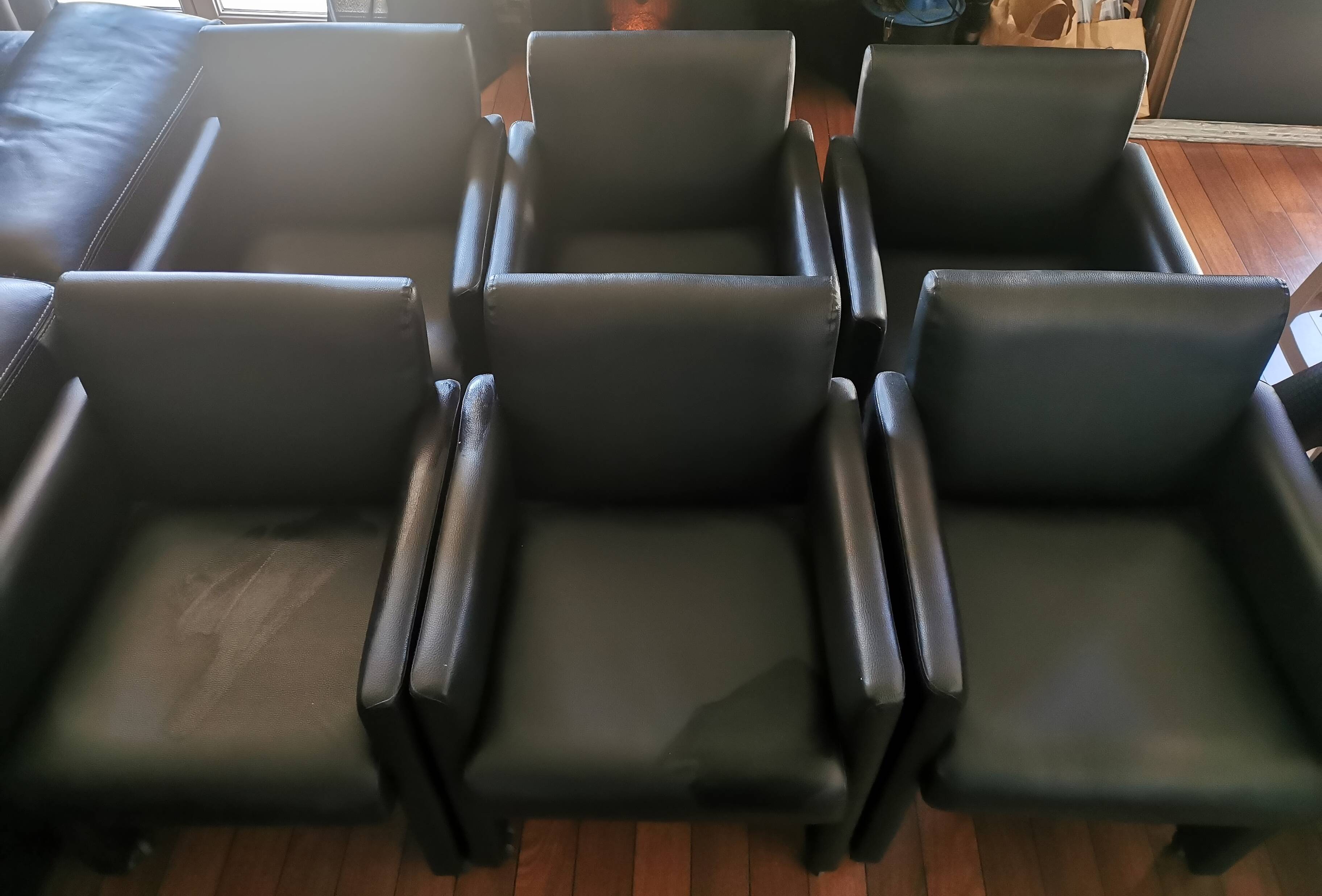 6 faux leather chairs on wheels